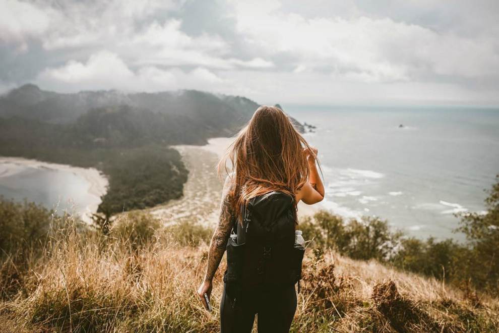 Woman enjoys the view from Cascade Head in Lincoln City, OR