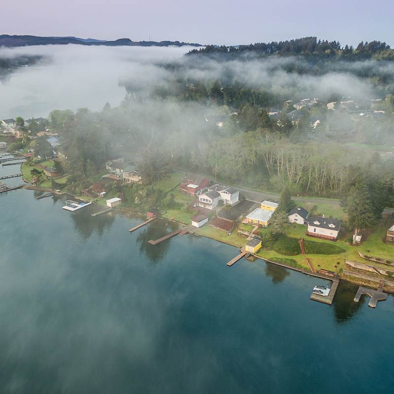aerial view of clouds floating over Devils Lake in Lincoln City, Oregon
