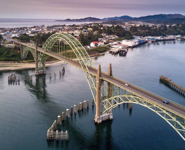 Cars drive along the Newport Bridge.