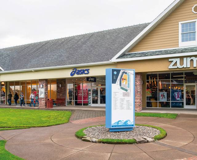 Store fronts for The North Face, Asics, and Zumiez, and a map at the Lincoln City Outlet Mall